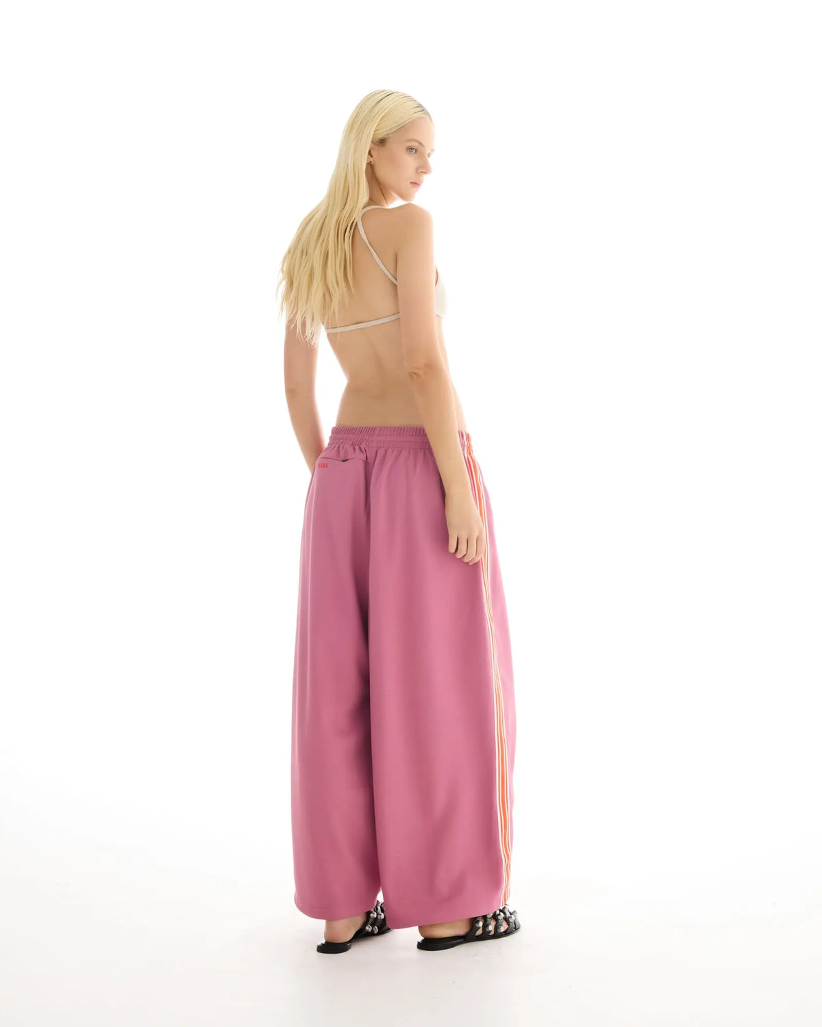 The Tales Harajuku Muted Pink Track Pant by THE TALES - pink colorway, styled view